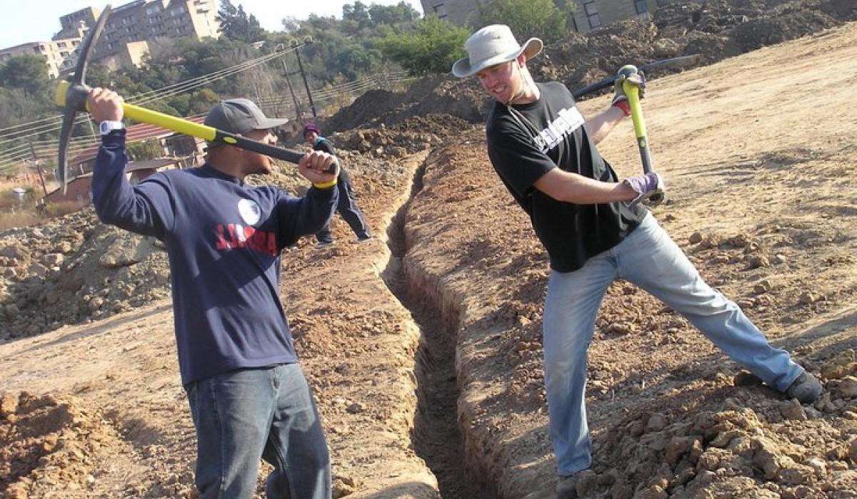 Students digging a trench