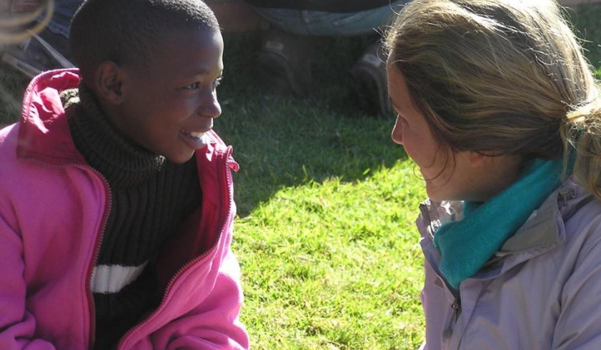 Student talking with orphan